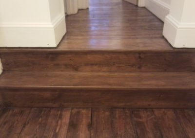 Sanded and varnished floor stained in Walnut