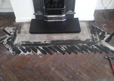 Wood Parquet repair around hearth area