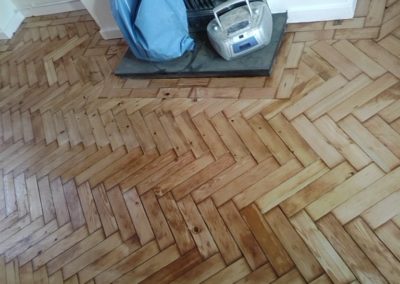 Repaired, sanded and varnished wood Parquet on completion